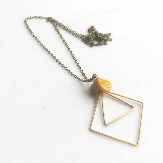 Yellow and brass necklace, glass flower pendant, geometric modern necklace